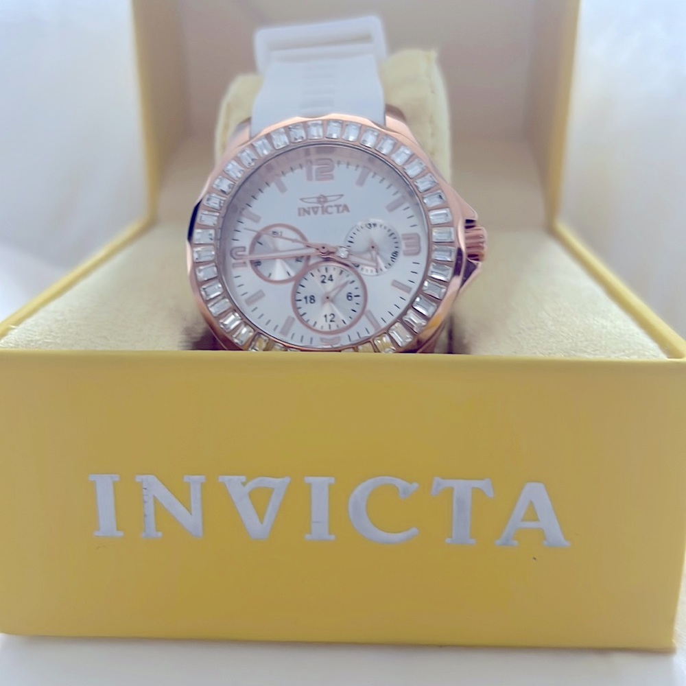 Invicta Rose Gold, pearl face surrounded by sparkling cubic embellishments.